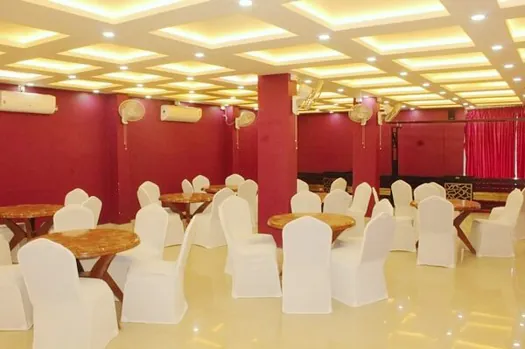Spacious Hotel CAPS Events Hall with seating arranged for guests