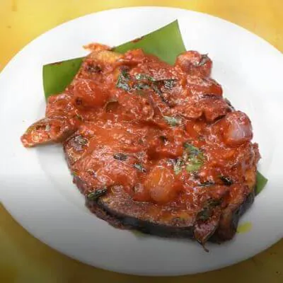 Spiced chicken fry served with fresh herbs