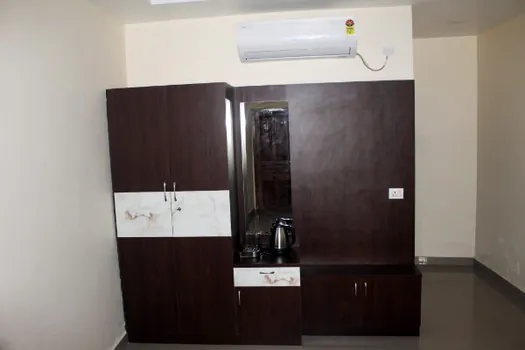 Hotel CAPS room with air conditioning, wardrobe and dressing area