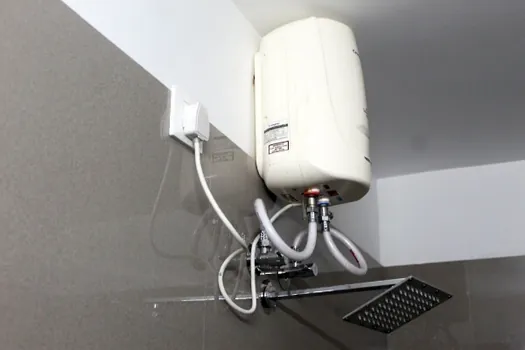 Hot water geyser and shower facility in a Hotel CAPS bathroom